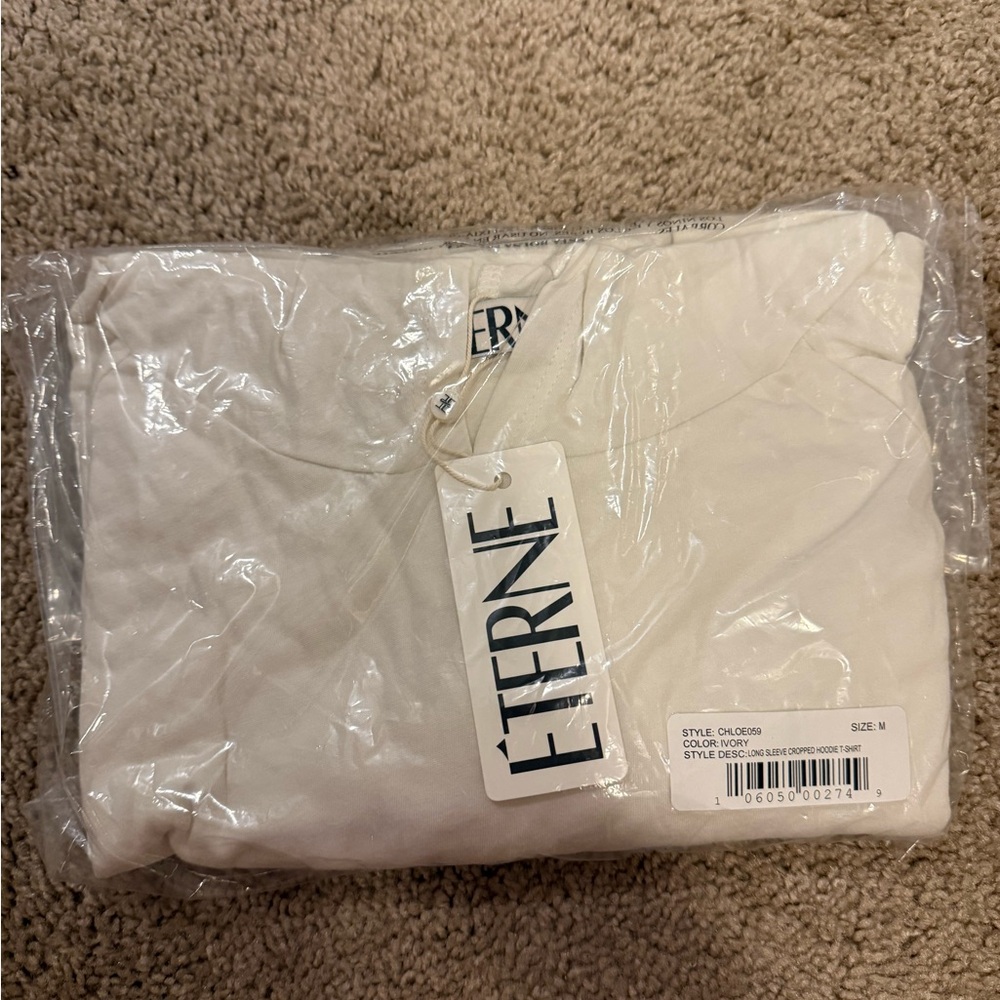 Eterne long sleeved cropped hoodie in ivory